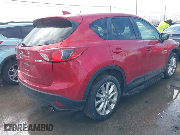 2015 Mazda CX-5 Grand Touring with VIN JM3KE4DY7F0477770, listed as a IAAI auction lot 41617849 with 106,135 mi miles. Bid and sale history available at carsss.com. Image 4.