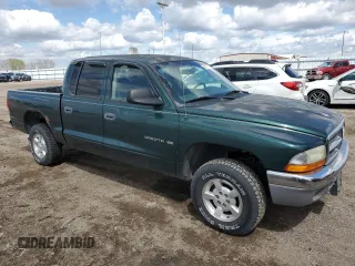 2001 Dodge Dakota z VIN 1B7HG2AX81S320355, wystawiony jako Copart lot #55410715 z przebiegiem 164 931 mil mil oraz Szkoda całkowita • Salvage title. Historia ofert i sprzedaży dostępna na DreamBid. Obrazek 4.