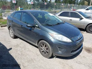 2011 Ford Fiesta SE with VIN 3FADP4BJ6BM154602, listed as a IAAI auction lot 41996619 with 104,370 mi miles. Bid and sale history available at carsss.com. Image 1.