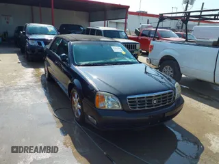 2001 Cadillac DeVille DHS z VIN 1G6KE57YX1U190955, wystawiony jako IAAI lot #41941668 z przebiegiem 191 040 mil mil oraz . Historia ofert i sprzedaży dostępna na DreamBid. Obrazek 1.