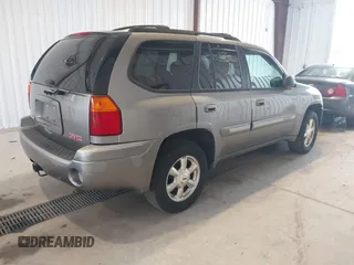 2005 GMC Envoy SLE z VIN 1GKDT13S252285747, wystawiony jako IAAI lot #42340642 z przebiegiem Nie podano mil oraz . Historia ofert i sprzedaży dostępna na DreamBid. Obrazek 4.