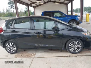 2015 Honda Fit EX-L z VIN 3HGGK5H81FM701122, wystawiony jako IAAI lot #42610165 z przebiegiem 74 969 mil mil oraz . Historia ofert i sprzedaży dostępna na DreamBid. Obrazek 14.
