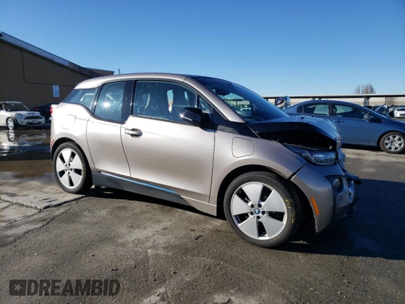 2015 BMW i3 with VIN WBY1Z4C56FV500991, listed as a Copart auction lot 43162913 with 57,885 mi miles. Bid and sale history available at carsss.com. Image 4.