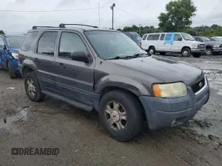 2003 Ford Escape XLT Popular 2 with VIN 1FMYU93163KE03257, listed as a Copart auction lot 66966644 with 209,618 mi miles and Salvage Title. Bid and sale history available at carsss.com. Image 4.