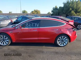2018 Tesla Model 3 Long Range Battery with VIN 5YJ3E1EA3JF035785, listed as a IAAI auction lot 41986774 with 33,965 mi miles and . Bid and sale history available at DreamBid. Image 14.