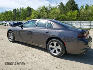 2015 Dodge Charger SXT with VIN 2C3CDXHG8FH794623, listed as a Copart auction lot 52000144 with 145,624 mi miles and Salvage Title. Bid and sale history available at DreamBid. Image 2.