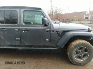 2021 Jeep Gladiator Sport S z VIN 1C6HJTAG3ML597041, wystawiony jako IAAI lot #41714640 z przebiegiem 46 402 mil mil oraz . Historia ofert i sprzedaży dostępna na DreamBid. Obrazek 13.