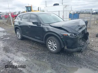 2023 Mazda CX-5 S Carbon Edition z VIN JM3KFBCM3P0270620, wystawiony jako IAAI lot #42022336 z przebiegiem 39 336 mil mil oraz . Historia ofert i sprzedaży dostępna na DreamBid. Obrazek 1.