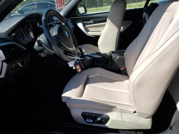2016 BMW 2 Series 228i with VIN WBA1K9C50GV710942, listed as a Copart auction lot 77700934 with 28,643 mi miles and Salvage Title. Bid and sale history available at carsss.com. Image 7.
