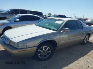 2001 Cadillac Eldorado Touring ETC z VIN 1G6ET12971B109319, wystawiony jako IAAI lot #41682779 z przebiegiem 147 515 mil mil oraz . Historia ofert i sprzedaży dostępna na DreamBid. Obrazek 6.