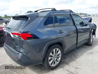 2021 Toyota RAV4 XLE Premium with VIN 2T3C1RFVXMC111658, listed as a IAAI auction lot 42594838 with 58,734 mi miles and . Bid and sale history available at DreamBid. Image 4.