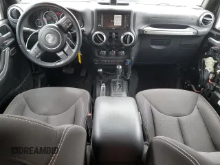 2016 Jeep Wrangler Unlimited Sahara with VIN 1C4BJWEG8GL150249, listed as a Copart auction lot 57574525 with 104,206 mi miles and Salvage title. Bid and sale history available at DreamBid. Image 8.