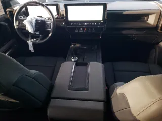2025 GMC Hummer EV 2X with VIN 1GKB0NDE5SU102096, listed as a Copart auction lot 47083615 with 8,713 mi miles and Salvage Title. Bid and sale history available at carsss.com. Image 8.