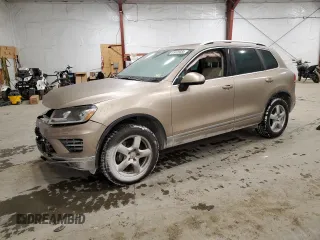 2016 Volkswagen Touareg Sport with VIN WVGEF9BP3GD010197, listed as a Copart auction lot 85826584 with 106,375 mi miles and Salvage Title. Bid and sale history available at DreamBid. Image 1.