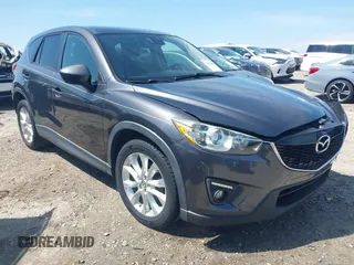 2014 Mazda CX-5 Grand Touring with VIN JM3KE2DY4E0338988, listed as a IAAI auction lot 41978286 with 144,735 mi miles. Bid and sale history available at carsss.com. Image 1.
