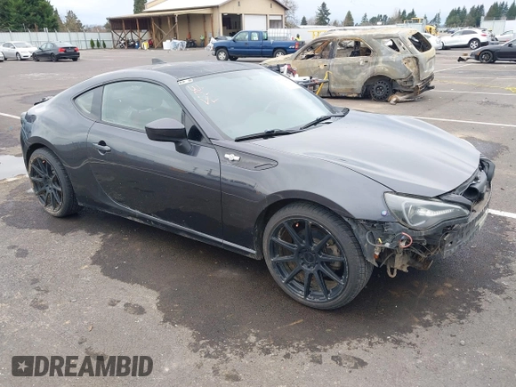 2015 Scion FR-S z VIN JF1ZNAA16F9710455, wystawiony jako IAAI lot #41838228 z przebiegiem 103 097 mil mil oraz . Historia ofert i sprzedaży dostępna na DreamBid. Obrazek 1.