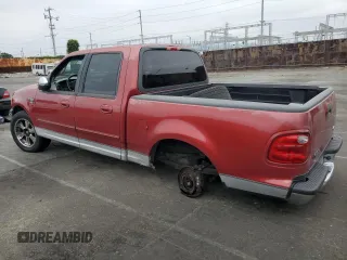 2001 Ford F-150 XLT with VIN 1FTRW07WX1KE51166, listed as a Copart auction lot 60164025 with 157,035 mi miles and Salvage title. Bid and sale history available at DreamBid. Image 2.