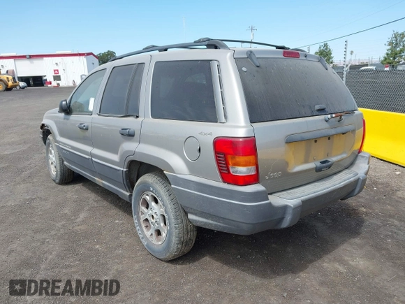 2001 Jeep Grand Cherokee Laredo with VIN 1J4GW48S11C503427, listed as a IAAI auction lot 40004360 with 232,712 mi miles and . Bid and sale history available at DreamBid. Image 3.