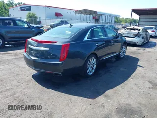 2014 Cadillac XTS Luxury z VIN 2G61M5S37E9211547, wystawiony jako IAAI lot #42373128 z przebiegiem 146 354 mil mil oraz . Historia ofert i sprzedaży dostępna na DreamBid. Obrazek 4.