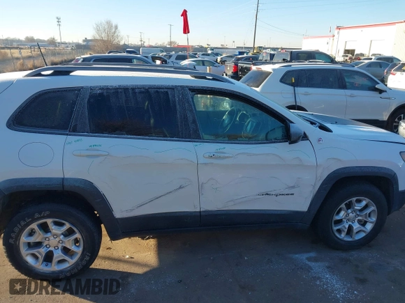 2019 Jeep Cherokee Trailhawk with VIN 1C4PJMBX8KD313712, listed as a IAAI auction lot 41448146 with 96,293 mi miles and . Bid and sale history available at DreamBid. Image 12.