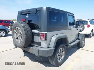 2014 Jeep Wrangler Sport with VIN 1C4AJWAG9EL155409, listed as a IAAI auction lot 41869906 with 102,400 mi miles and . Bid and sale history available at carsss.com. Image 4.
