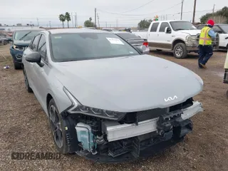 2024 Kia K5 GT-Line z VIN 5XXG64J20RG256798, wystawiony jako IAAI lot #41407862 z przebiegiem 19 114 mil mil oraz . Historia ofert i sprzedaży dostępna na DreamBid. Obrazek 1.