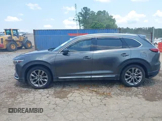 2018 Mazda CX-9 Grand Touring with VIN JM3TCADY7J0217595, listed as a IAAI auction lot 42381331 with 130,604 mi miles and . Bid and sale history available at DreamBid. Image 14.