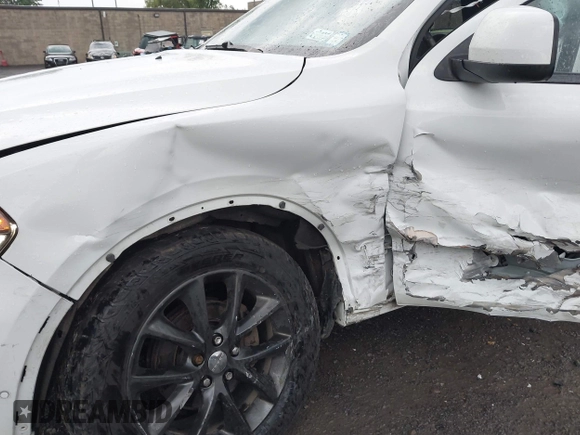 2014 Dodge Durango SXT with VIN 1C4RDJAG0EC561950, listed as a IAAI auction lot 42650331 with 106,959 mi miles and . Bid and sale history available at DreamBid. Image 6.