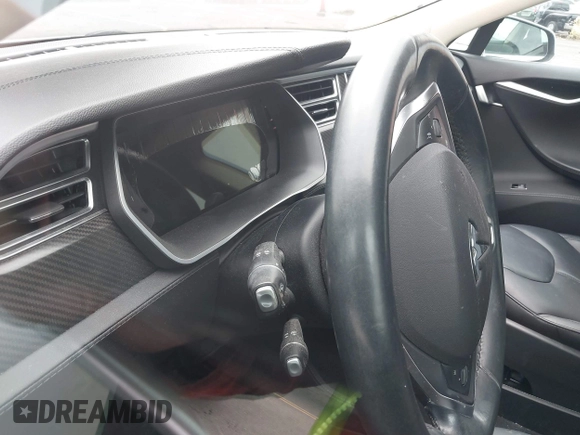 2014 Tesla Model S 60 with VIN 5YJSA1S13EFP53662, listed as a IAAI auction lot 42249930 with Not provided miles and . Bid and sale history available at DreamBid. Image 14.