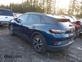 2023 Volkswagen ID.4 Pro z VIN 1V2DNPE81PC017620, wystawiony jako IAAI lot #41573053 z przebiegiem 15 462 mil mil oraz . Historia ofert i sprzedaży dostępna na DreamBid. Obrazek 3.