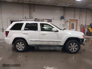 2009 Jeep Grand Cherokee Limited with VIN 1J8GR58K29C553812, listed as a IAAI auction lot 41520065 with 203,595 mi miles. Bid and sale history available at carsss.com. Image 14.