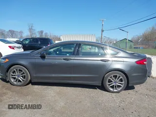 2017 Ford Fusion SE z VIN 3FA6P0HD8HR211638, wystawiony jako IAAI lot #42029399 z przebiegiem 90 262 mil mil oraz . Historia ofert i sprzedaży dostępna na DreamBid. Obrazek 14.