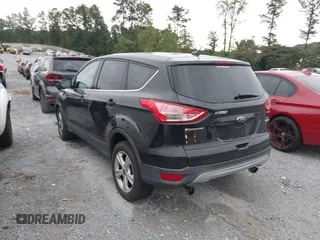 2014 Ford Escape SE with VIN 1FMCU0GX9EUB21853, listed as a IAAI auction lot 40313063 with 106,687 mi miles. Bid and sale history available at carsss.com. Image 3.