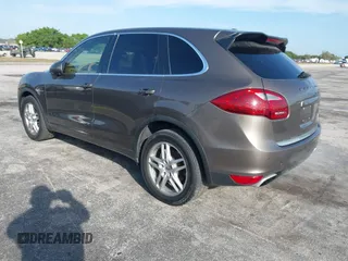 2011 Porsche Cayenne S Hybrid with VIN WP1AE2A29BLA94414, listed as a IAAI auction lot 41644386 with 76,095 mi miles. Bid and sale history available at carsss.com. Image 3.