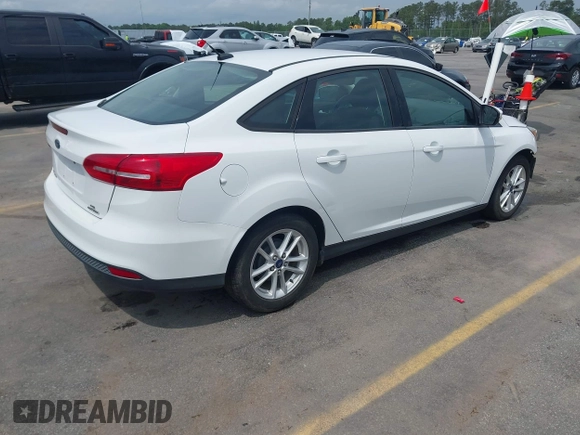2015 Ford Focus SE with VIN 1FADP3F28FL204145, listed as a IAAI auction lot 42107720 with 129,441 mi miles and . Bid and sale history available at DreamBid. Image 4.