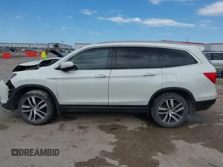 2017 Honda Pilot Touring with VIN 5FNYF6H9XHB034001, listed as a IAAI auction lot 42092549 with 142,422 mi miles and . Bid and sale history available at DreamBid. Image 14.