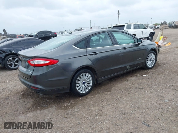 2016 Ford Fusion SE Hybrid with VIN 3FA6P0LU5GR235241, listed as a IAAI auction lot 41697504 with 165,510 mi miles. Bid and sale history available at carsss.com. Image 4.