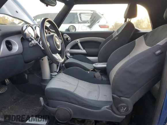 2006 MINI Convertible S with VIN WMWRH33526TL93206, listed as a Copart auction lot 46114075 with 60,526 mi miles and Salvage title. Bid and sale history available at DreamBid. Image 7.