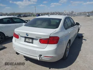 2014 BMW 3 Series 328i xDrive with VIN WBA3B3G51ENR81859, listed as a IAAI auction lot 41828729 with 129,498 mi miles. Bid and sale history available at carsss.com. Image 4.