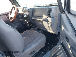 1998 Jeep Wrangler Sport with VIN 1J4FY19S4WP716469, listed as a IAAI auction lot 41506513 with 142,289 mi miles. Bid and sale history available at carsss.com. Image 5.