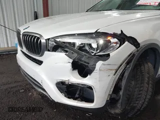 2015 BMW X6 sDrive35i z VIN 5UXKU0C54F0F91660, wystawiony jako IAAI lot #42375390 z przebiegiem 150 209 mil mil oraz . Historia ofert i sprzedaży dostępna na DreamBid. Obrazek 6.