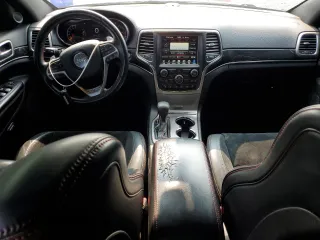 2017 Jeep Grand Cherokee Trailhawk with VIN 1C4RJFLT3HC614449, listed as a Copart auction lot 58559335 with 153,051 mi miles and Salvage title. Bid and sale history available at DreamBid. Image 8.