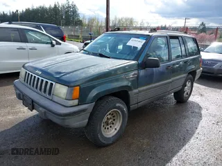 1995 Jeep Grand Cherokee Laredo with VIN 1J4GZ58SXSC676393, listed as a IAAI auction lot 41943464 with 244,317 mi miles. Bid and sale history available at carsss.com. Image 2.