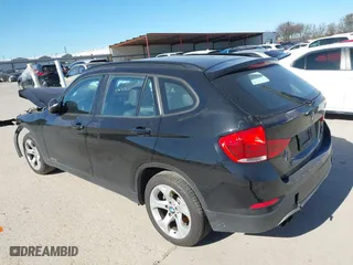 2015 BMW X1 sDrive28i with VIN WBAVM1C58FV498559, listed as a IAAI auction lot 41208638 with 100,452 mi miles. Bid and sale history available at carsss.com. Image 3.