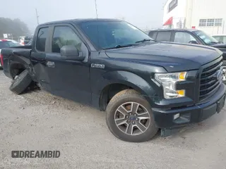 2015 Ford F-150 XL with VIN 1FTEX1CF2FKD12874, listed as a IAAI auction lot 41860610 with 242,215 mi miles. Bid and sale history available at carsss.com. Image 1.