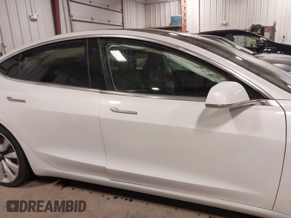 2018 Tesla Model 3 Long Range Battery with VIN 5YJ3E1EB5JF084446, listed as a IAAI auction lot 41209852 with 70,125 mi miles and . Bid and sale history available at DreamBid. Image 14.