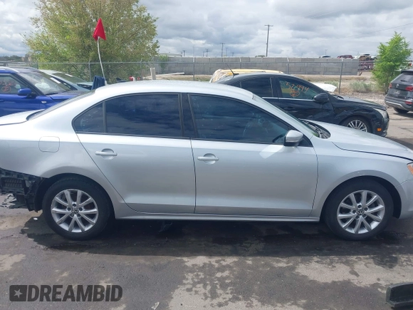 2011 Volkswagen Jetta SE z VIN 3VWDZ7AJ7BM340220, wystawiony jako IAAI lot #42136168 z przebiegiem 147 864 mil mil oraz . Historia ofert i sprzedaży dostępna na DreamBid. Obrazek 14.