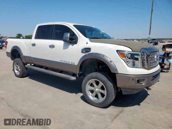 2017 Nissan Titan Pro-4X z VIN 1N6BA1F42HN575024, wystawiony jako Copart lot #52025835 z przebiegiem 23 422 mil mil oraz Czysty tytuł • Clean title. Historia ofert i sprzedaży dostępna na DreamBid. Obrazek 4.