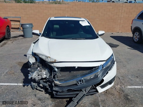 2017 Honda Civic Coupe Touring with VIN 2HGFC3B95HH356466, listed as a IAAI auction lot 41651157 with 100,940 mi miles. Bid and sale history available at carsss.com. Image 12.