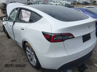 2023 Tesla Model Y Long Range with VIN 7SAYGDEE2PA145398, listed as a IAAI auction lot 41546573 with 20,812 mi miles and . Bid and sale history available at carsss.com. Image 3.